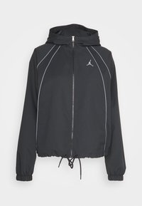 Svart jacka med huva, dragkedja framtill och elastiska ärmslut. Har grå accentlinjer och en logotyp på bröstet. Justerbar dragsko i nederkant.