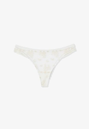 Tanga blanco transparente con delicados bordados florales y cintura elástica con pequeños volantes.