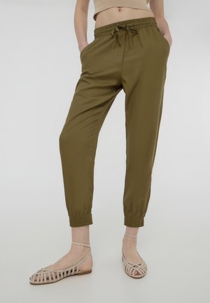 JOGGING WITH A DRAWSTRING AND SOLID CUFFS - Pantaloni sportivi - verde militare