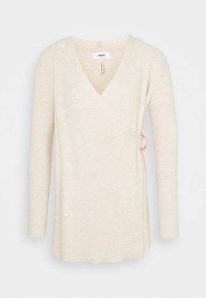 Cream-colored ribbed knit wrap sweater with long sleeves and side buckle detail, size small.