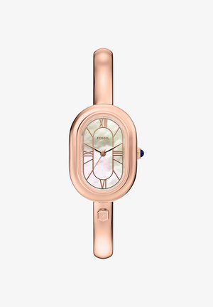 Hodinky z růžového zlata s oválným pouzdrem, bílým ciferníkem z perleti, stříbrnými hodinovými značkami a modrým akcentem na korunce. Pružný kovový náramek.