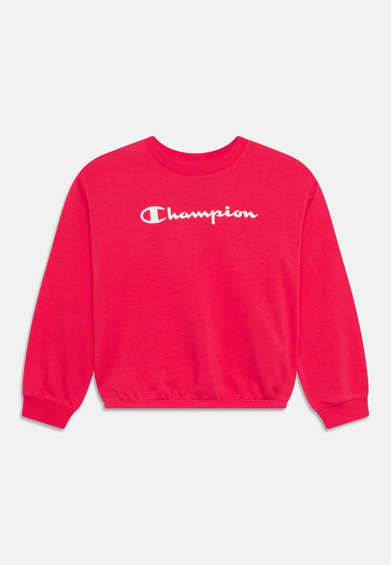 Sudadera roja hecha de algodón suave, con mangas largas, puños acanalados y cuello redondo. Presenta el logotipo blanco de "Champion" en la parte frontal.