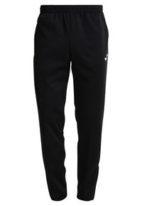 Pantalon de sport noir avec une taille élastique, coupe fuselée et poches latérales. Présente un petit logo blanc sur le côté gauche.