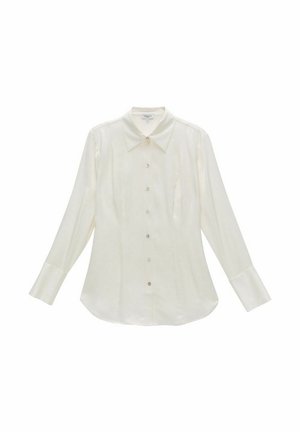 Langsleeve crème knoopshirt gemaakt van glad, lichtgewicht stof. Kenmerken zijn een puntige kraag, een borstzak en een gebogen zoom.