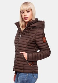 Brown padded jacket with a hood, featuring a zip closure, side pockets, and a branded leather patch on the left sleeve. Smooth texture.