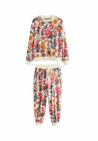 Květinová souprava mikiny a tepláků, s krémovým základem a červenými, žlutými a modrými květy. Měkká látka, žebrované manžety a nastavitelné stahovací šňůrky.