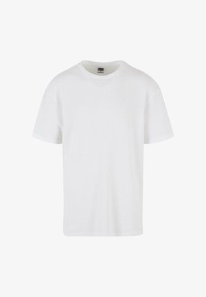 Bijela majica s kratkim rukavima od teksturiranog pamuka. Ima okrugli izrez i ravni rub. Minimalistički dizajn bez vidljivih logotipa.