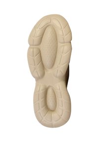 Suola di una sneaker, caratterizzata da un materiale in gomma beige chiaro con un motivo testurizzato, che include sezioni a nido d'api e design del battistrada.