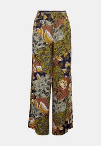 Pantalon à jambes larges avec un imprimé vibrant aux couleurs vert, jaune et bleu marine. Confectionné en tissu léger avec divers motifs floraux et abstraits.