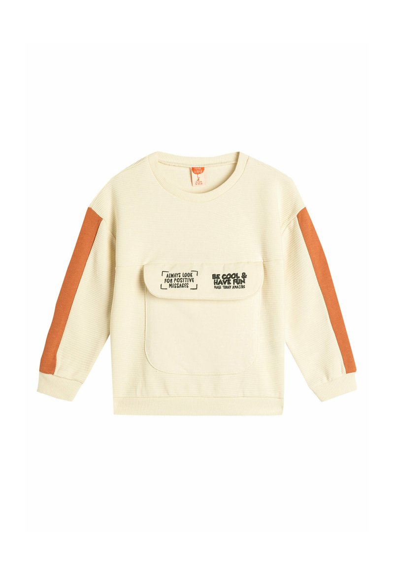 Sudadera de color crema claro con textura de canalé, detalles en naranja en las mangas y un bolsillo frontal con mensajes positivos impresos.