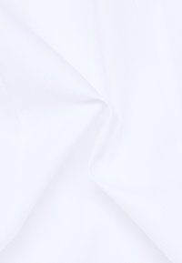 White fabric displaying a textured surface with small, raised patterns. The material appears smooth and lightweight, with a subtle sheen.