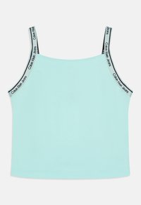 Menta zöld ujjatlan felső vékony pántokkal, a pántok szélein Calvin Klein Jeans logóval. Az anyag sima és testhezálló.