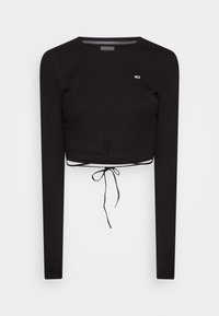 Crop top nero a coste a maniche lunghe con scollo rotondo, piccolo logo sul petto e dettaglio con fiocco davanti in vita.