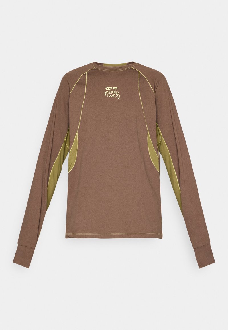 Long-sleeve brown shirt with olive green underarm panels and yellow stitching, featuring small stylized text and logo on chest center.