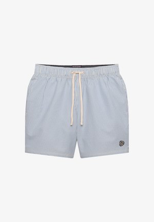 Pantalones cortos con cordón de rayas finas azules y blancas, con bolsillos laterales y un pequeño emblema negro en la parte inferior de la pierna derecha.