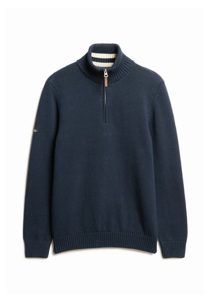 Navy pullover trui met een hoge ribgebreide kraag, halve ritssluiting en textuurstof. Kenmerkt een gestreepte binnenkraag en ribgebreide manchetten.