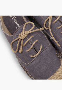 Grey canvas lace-up shoes with a textured finish and jute detailing. Features beige laces and side stitching. Rounded toe design.