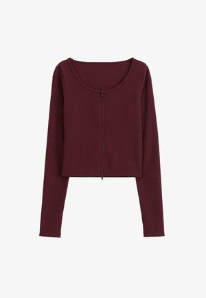Burgundy afskåret langærmet top med rund halsudskæring og frontlynlås. Har ribbestruktur og tætsiddende design.