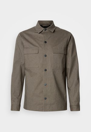 Hnědá károvaná košile s límcem, předním zapínáním na knoflíky, dvěma náprsními kapsami a dlouhými rukávy. Vyrobena z texturované látky.