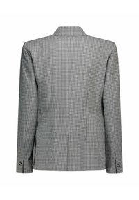 Veste à carreaux en nuances de noir et blanc. Coupe ajustée avec manches longues et col cranté. Dotée de doubles boutons aux poignets.