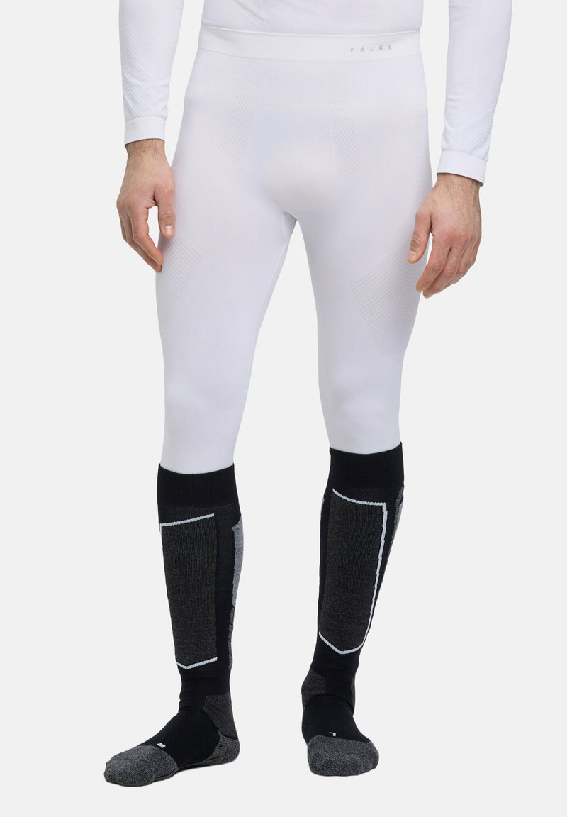 Weiße lange thermo Leggings mit strukturiertem Muster, kombiniert mit schwarz-grauen knielangen Socken, die eine verstärkte Ferse und Zehenansatz haben.