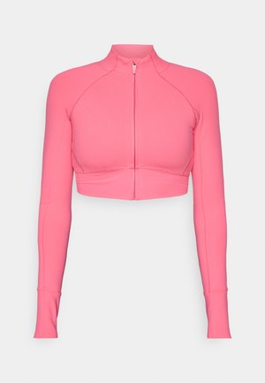 Pink cropped zip-up jacket with long sleeves, made from smooth fabric, featuring fitted design and contrasting stitching details.