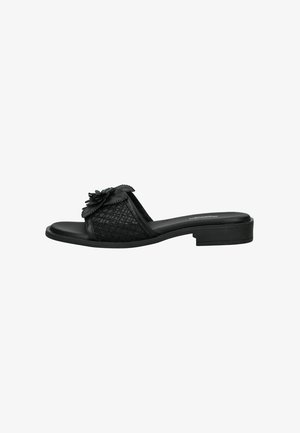 Black open-toe slide sandal with a low heel, mesh upper band, and decorative flower detail on top.