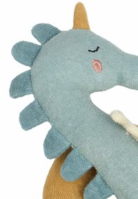 Stuffed dragon toy in soft blue fabric with beige and brown accents. Features textured scales, a yellow horn, and embroidered facial details.