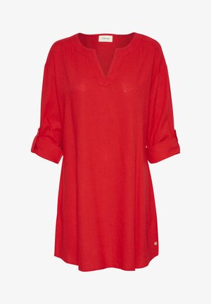 Punane linane tunika V-kaelusega, kolmeveerandi rullitud varrukatega ja kaarduvate servadega. Omab väikest kuldset aktsenti alumises servas.