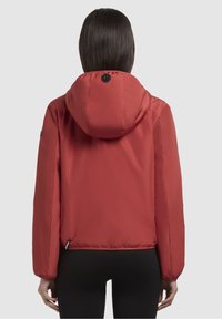 Red padded jacket with a hood, featuring a smooth texture, elastic cuffs, and a logo on the back. Clean design with a modern silhouette.