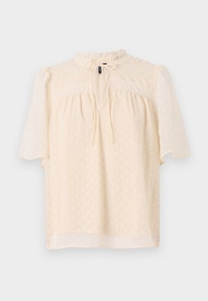 Helebees beez blouse puffidega varrukate ja tekstureeritud kangaga, millel on peened täpid, võtmeaugu kaelus sidumiseks ja pitsäär yoke'i ääres.