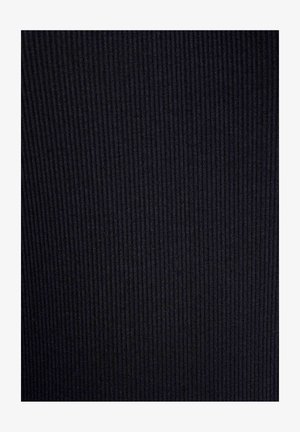 Close-up of black ribbed fabric texture with vertical lines creating subtle shadows and depth.