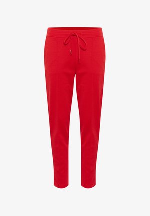 Rote Jogginghosen aus weichem Stoff mit einem Kordelzugbund und taillierter Beinform. Glatte Textur ohne Muster oder Verzierungen.