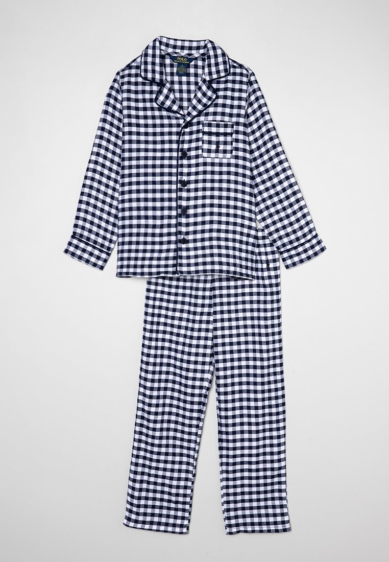 Ensemble de pyjama à carreaux bleu marine et blanc en tissu doux. Comprend un haut à boutons à manches longues avec une poche sur la poitrine et un pantalon assorti.