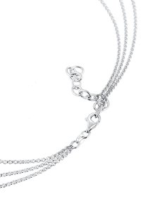 Sterling sølv halskæde med tre kæder, udstyret med en lobster clasp, runde led og en poleret overflade. Bemærkelsesværdigt for sit lette design.