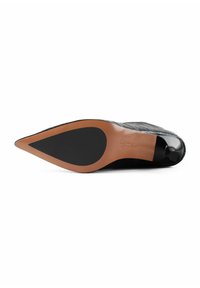 Black leather high-heeled shoe with a pointed toe, textured surface, and a tan rubber sole, featuring a black accent at the heel.