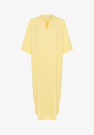 Dzeltena tunika kleita, kas izgatavota no viegla auduma, ar V-veida kaklu, īsām piedurknēm un sānu kabatām. Brīva piegriezuma ar potītei garu dizainu.