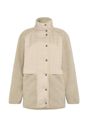 Beige fleecejakke med quiltet frontpanel, høj krave, trykknapper ned langs midten og lange ærmer.