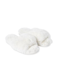 Pantofole bianche e pelose con una consistenza morbida, design con punta aperta e fascia incrociata imbottita. Caratterizzate da una suola piatta e flessibile.