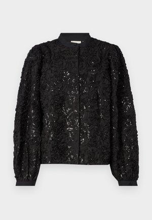 Black floral-textured jacket featuring sequins, rounded collar, and long puffed sleeves with fitted cuffs, enhancing its three-dimensional design.