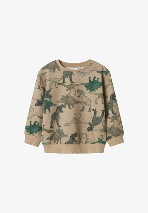 Sudadera color marrón claro con estampados de dinosaurios en verde. Presenta un cuello redondo y puños y dobladillo acanalados, diseñada para la comodidad y el estilo.