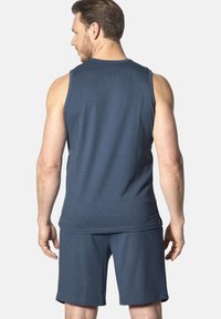 Men's athletic wear set in navy. Features a sleeveless shirt and matching shorts, made of soft, breathable fabric with a smooth texture.