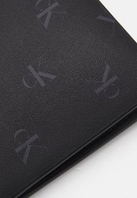 Calvin Klein Jeans BIFOLD COIN UNISEX - Monedero - black