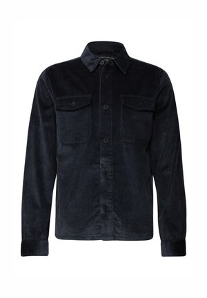 Camisa de pana azul marino con mangas largas, frontal abotonado, dos bolsillos en el pecho y un cuello clásico. Presenta una textura acanalada y botones negros.