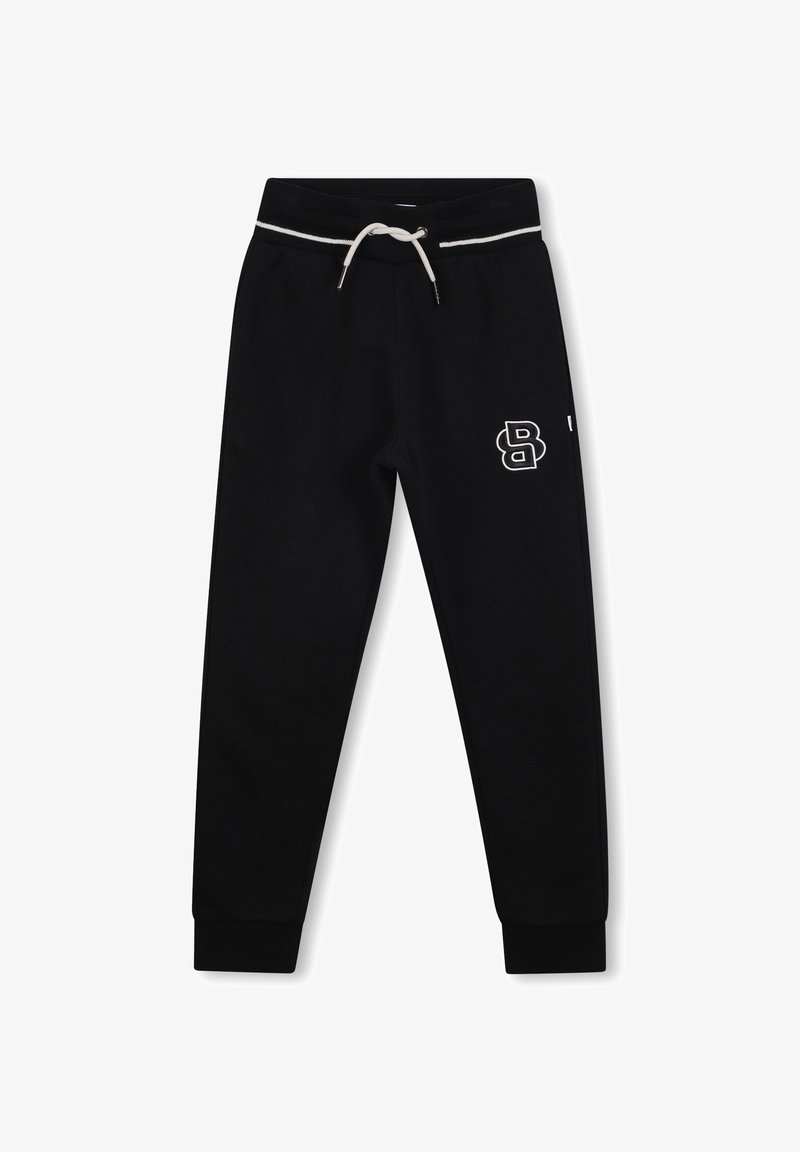 Pantalons de survêtement noirs avec une taille élastique à cordon, surpiqûres blanches et un logo blanc sur le côté gauche. Poignets côtelés aux chevilles.