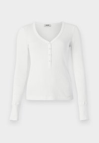 Bílý dlouhý rukáv ribbed henley top s V-výstřihem a pěti knoflíkovou légou. Má přiléhavé manžety a hladkou texturu.