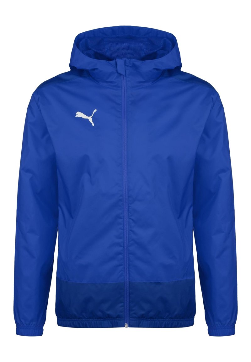 Veste coupe-vent à capuche Puma bleue avec fermeture éclair à l'avant et logo Puma blanc sur la poitrine gauche, poignets élastiques et bandeau inférieur bleu foncé.