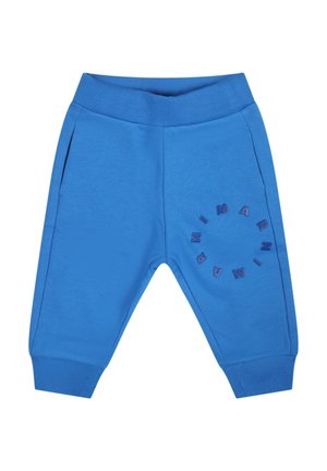 Pantaloni da tuta blu in cotone con vita elasticizzata, tasche laterali e un design circolare testurizzato con lettere sulla gamba sinistra.