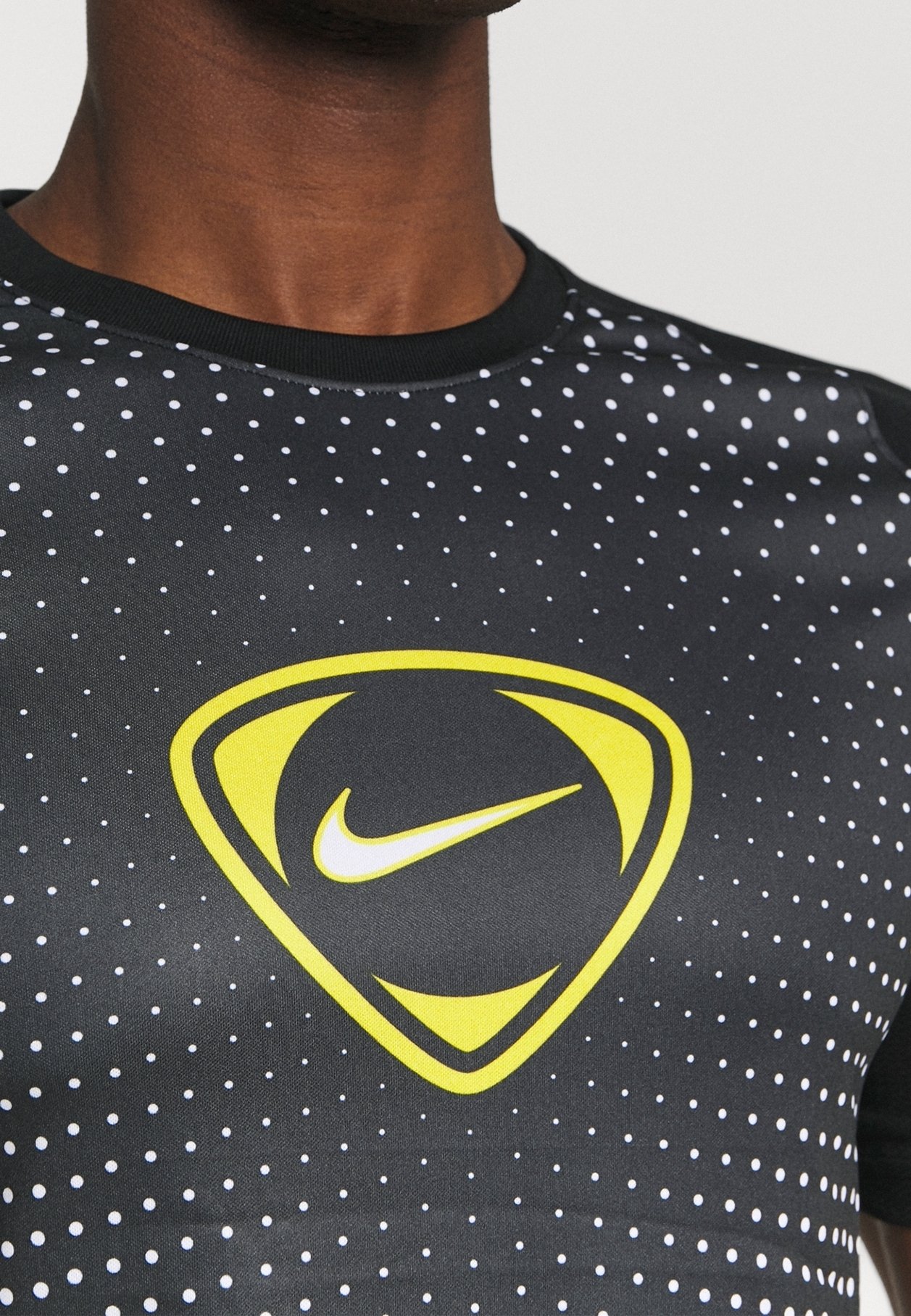 black nike shirt with white dots