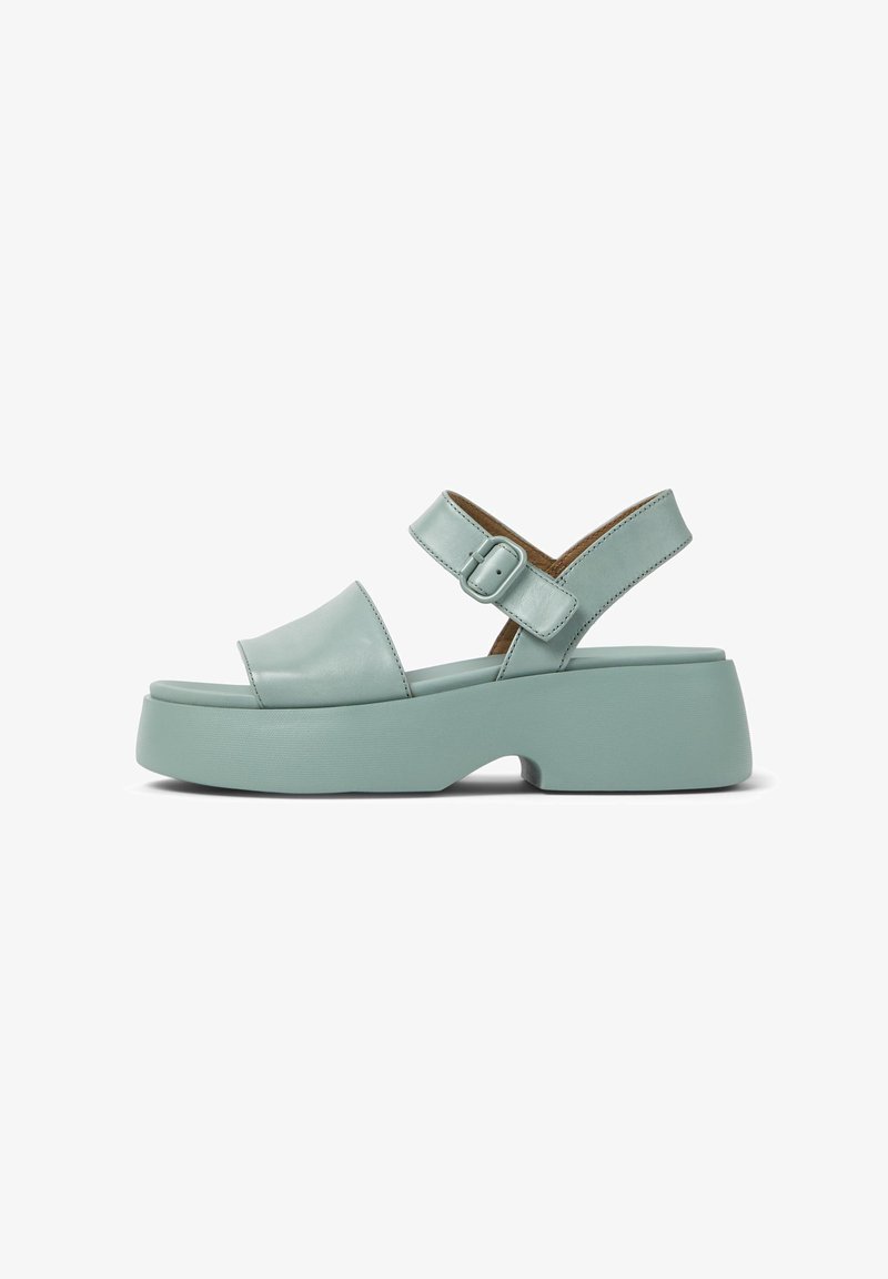 Aqua leather sandal with an open toe, adjustable buckle strap, and a chunky platform sole for added height and stability.